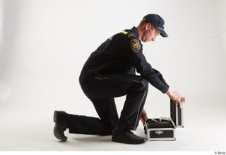 Sam Atkins Fireman Pose with Case kneeling whole body 0014.jpg